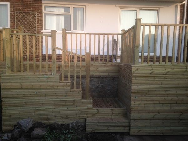 The finished raised decking with steps and balustrade
