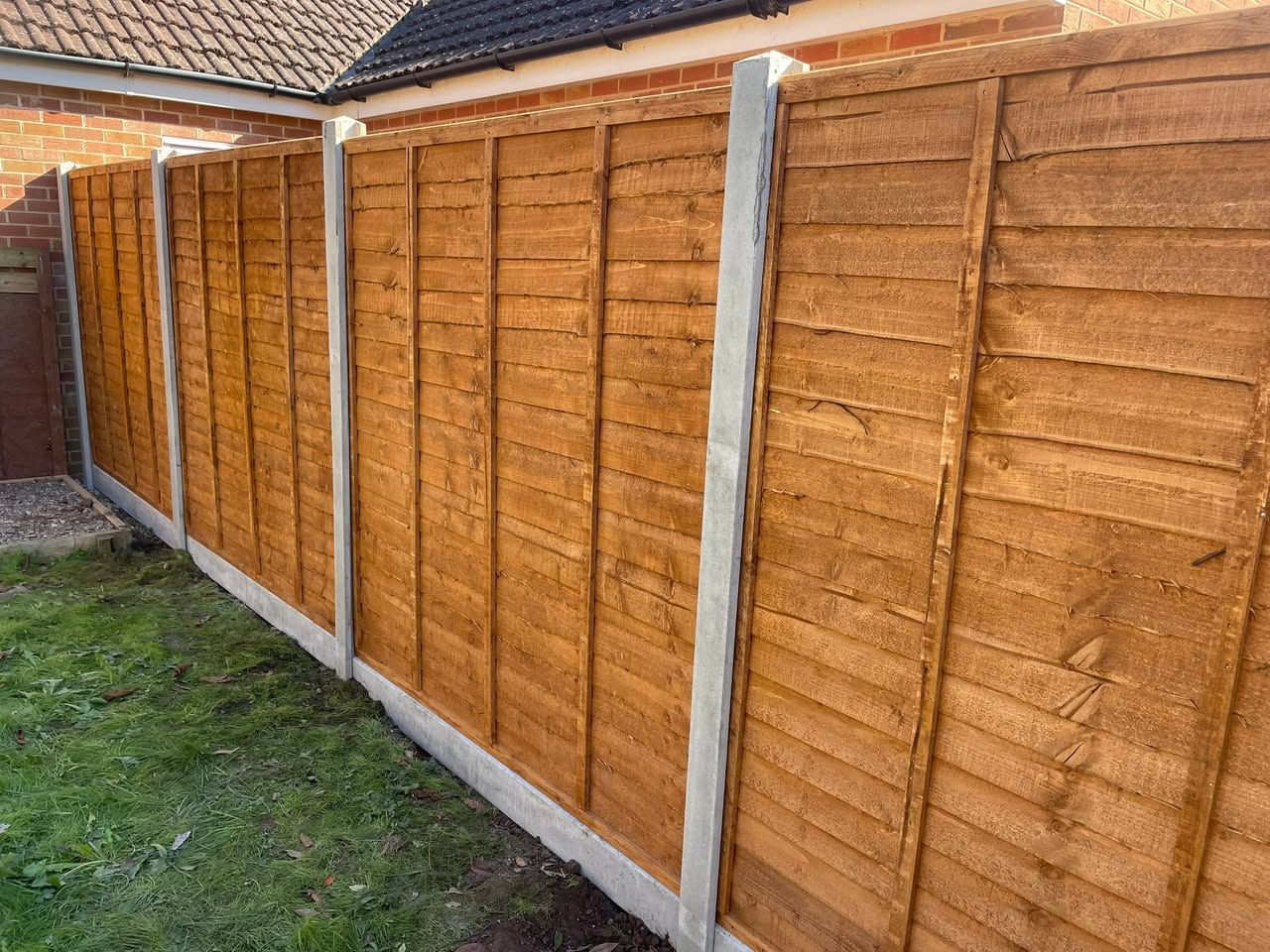 A new 6ft 6in fence with concrete posts and gravel boards