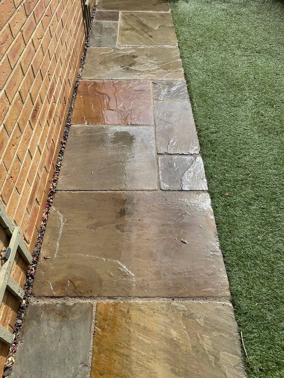 A sandstone path re-pointed beside a house