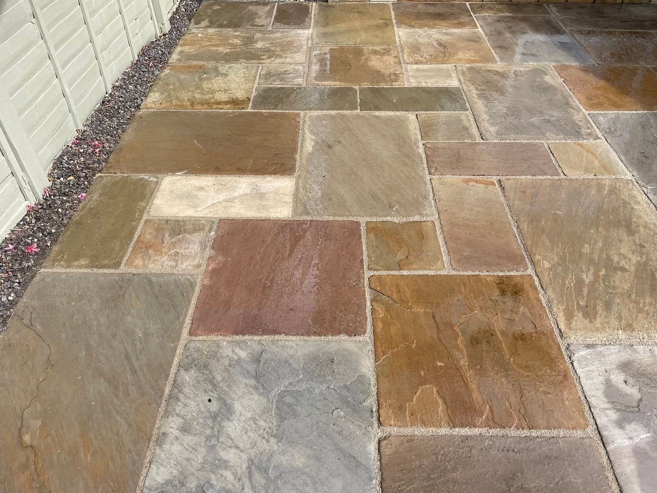 A sandstone patio freshly re-pointed