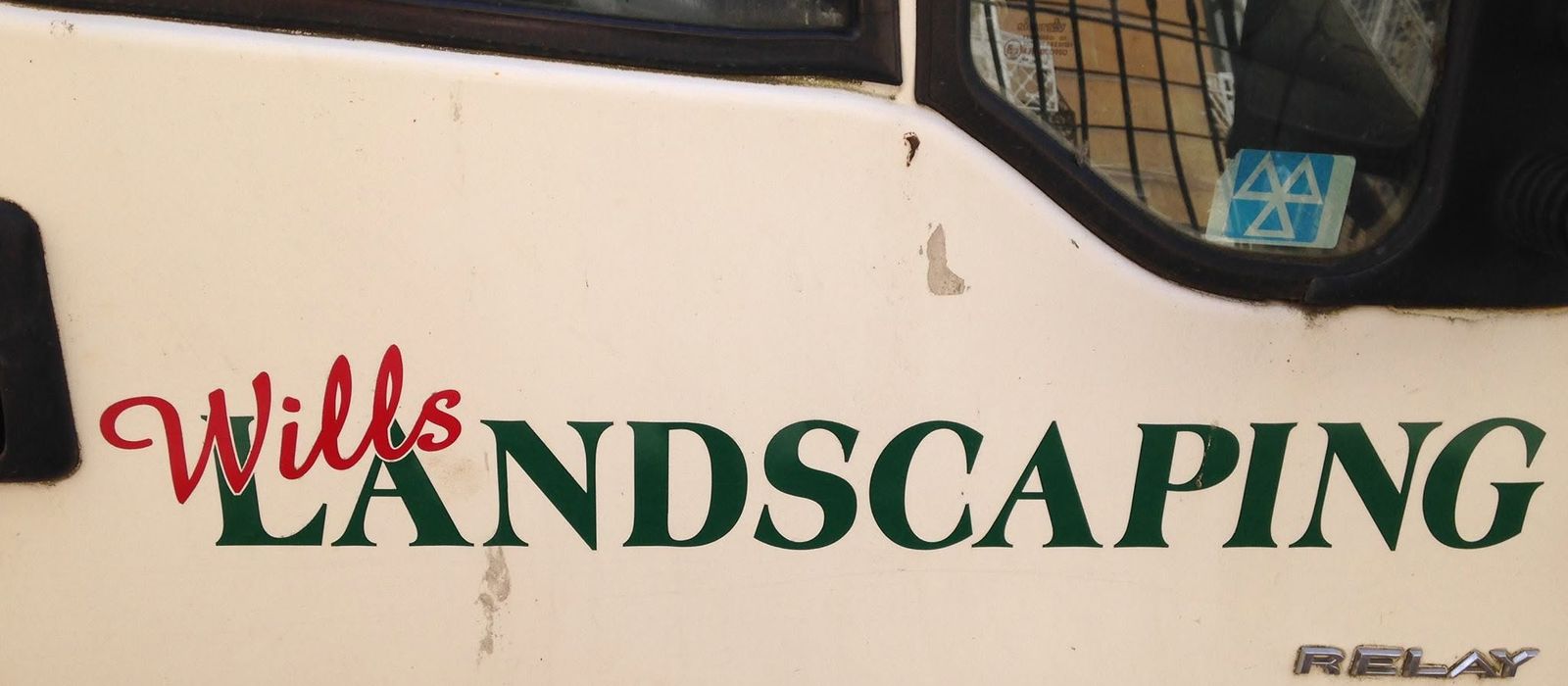 The Wills Landscaping signwriting on the side of Will's white van